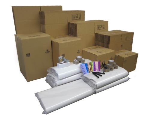 Moving boxes, several tape dispensers and rolls of plastic wrap