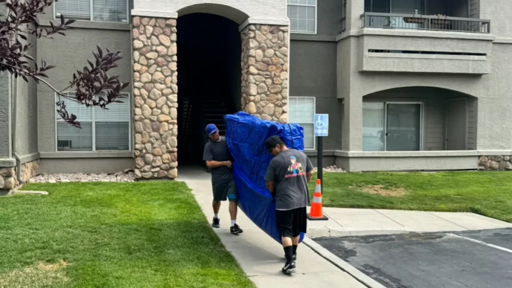 Movers Salt Lake City carrying protected furniture