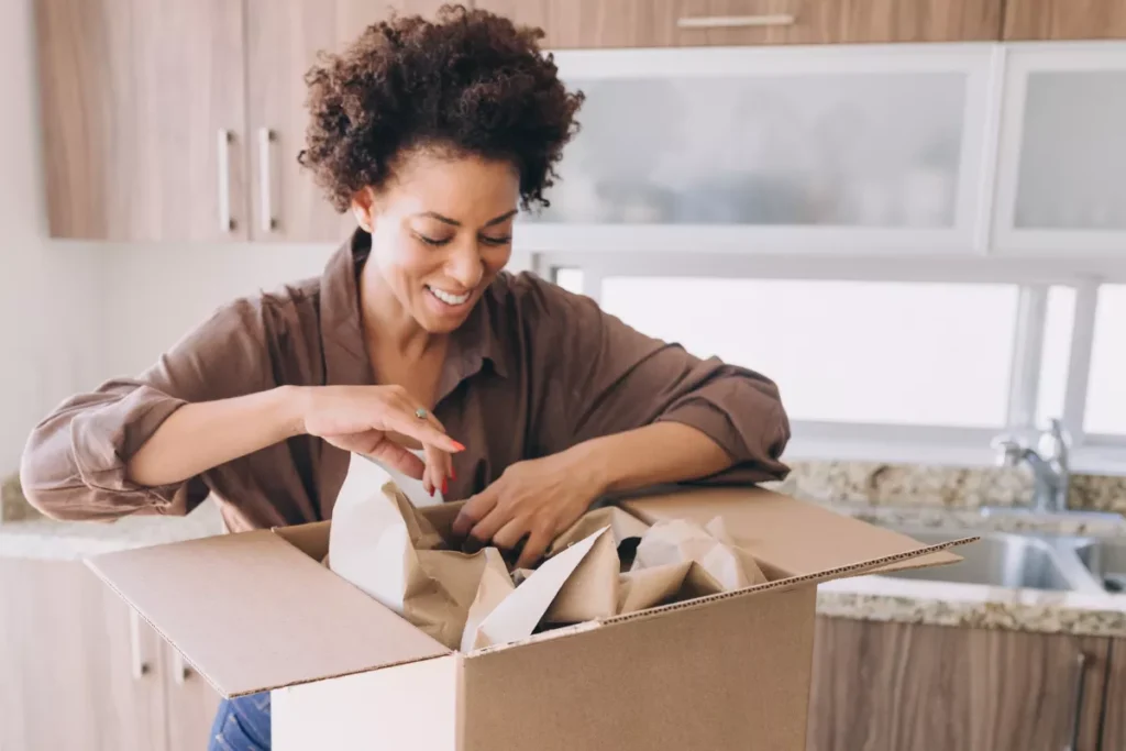 Woman packing kitchen supplies for Salt Lake City Movers