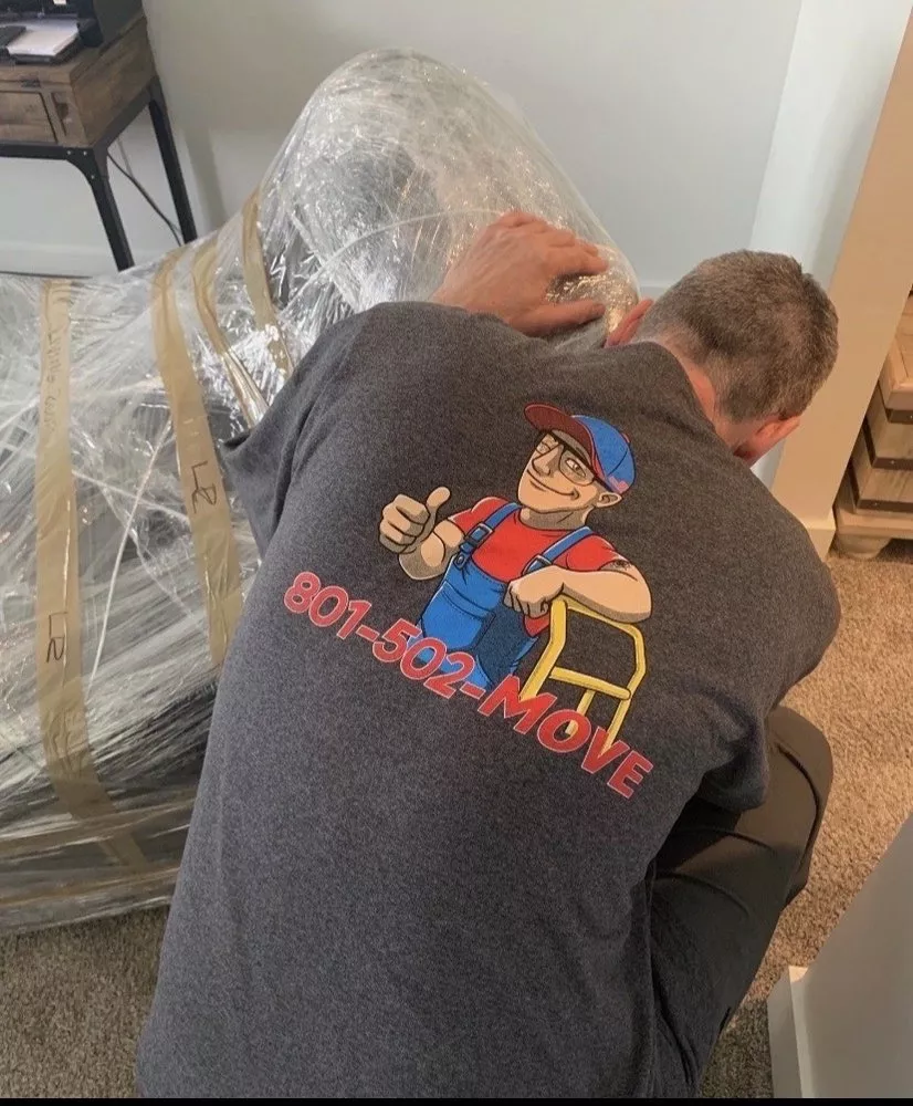 My Small Moves Salt Lake City Movers wrapping furniture in saran wrap